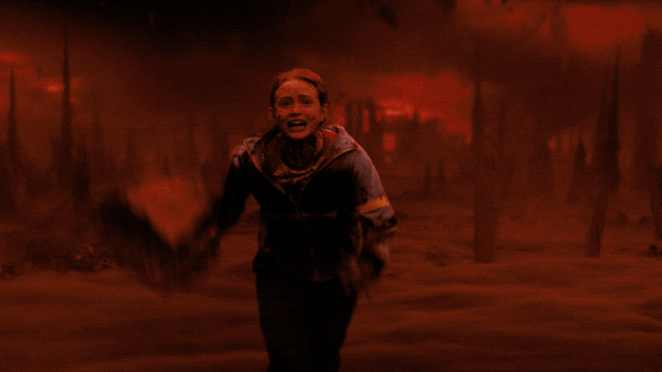 Max from Stranger Things running away from a falling building Vecna's world.